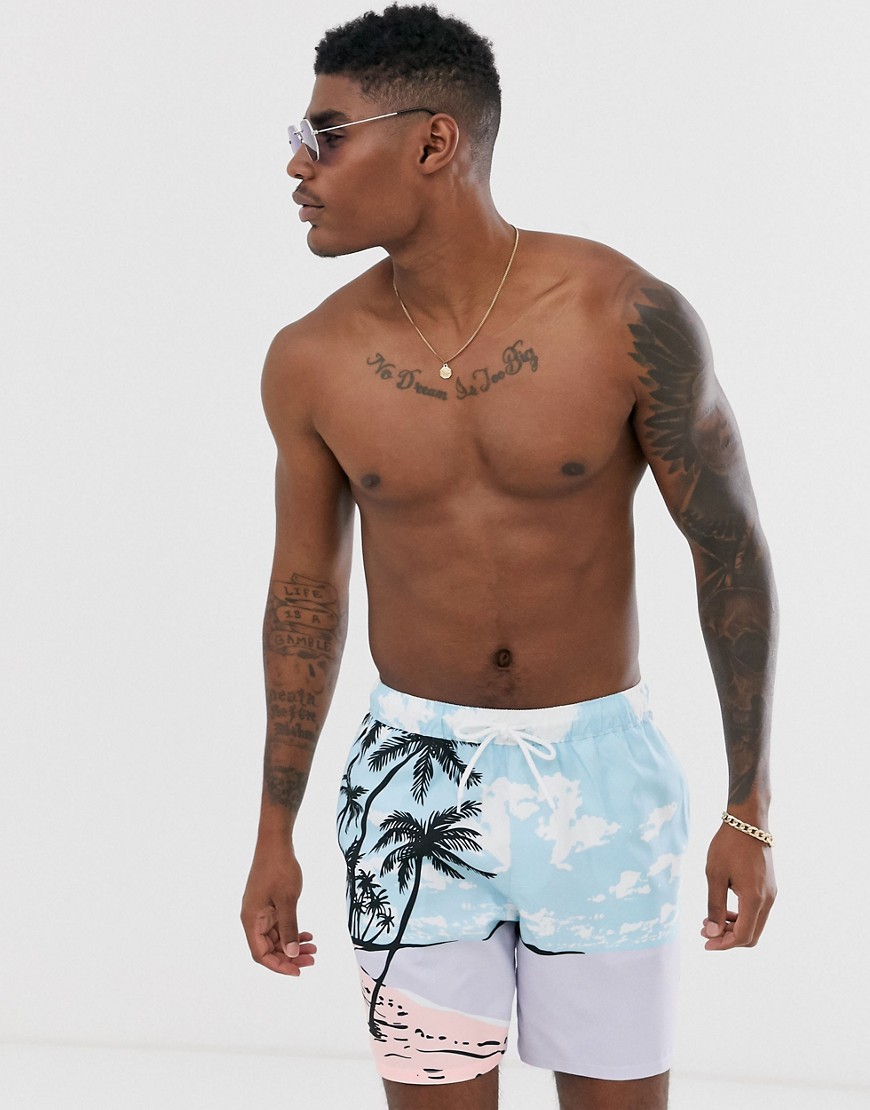 ASOS DESIGN swim shorts with beach scene print in mid length