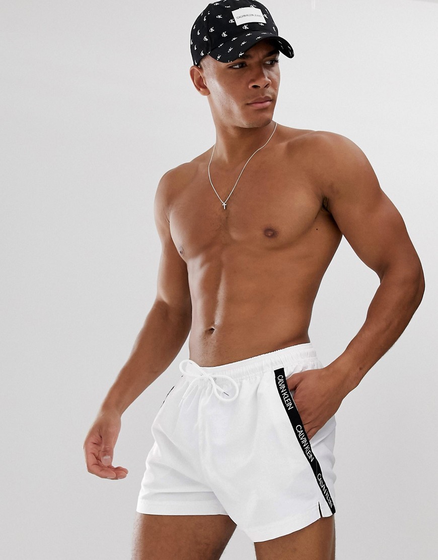 Calvin Klein logo tape swim shorts in white
