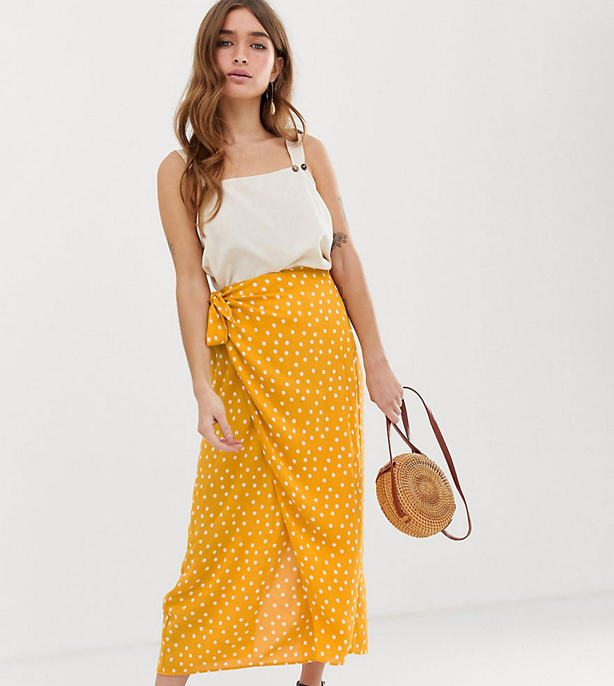 ASOS DESIGN Petite wrap maxi skirt with tie front in yellow polka dot