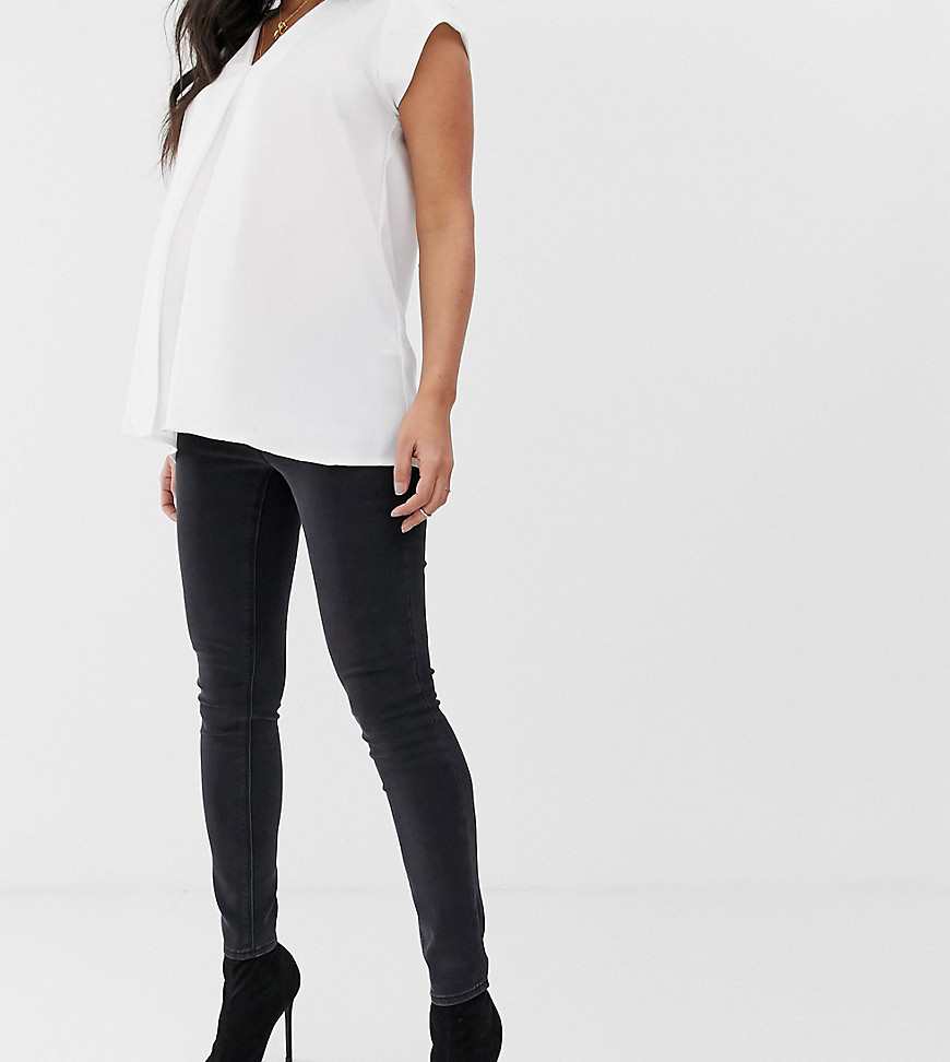 ASOS DESIGN Maternity high rise ridley 'skinny' jeans in washed black with under the bump waistband