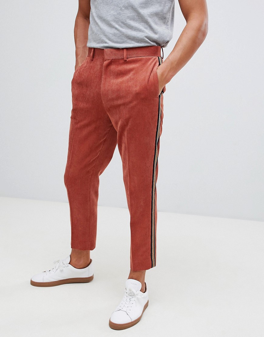 ASOS DESIGN tapered trouser in rust cord with side stripe