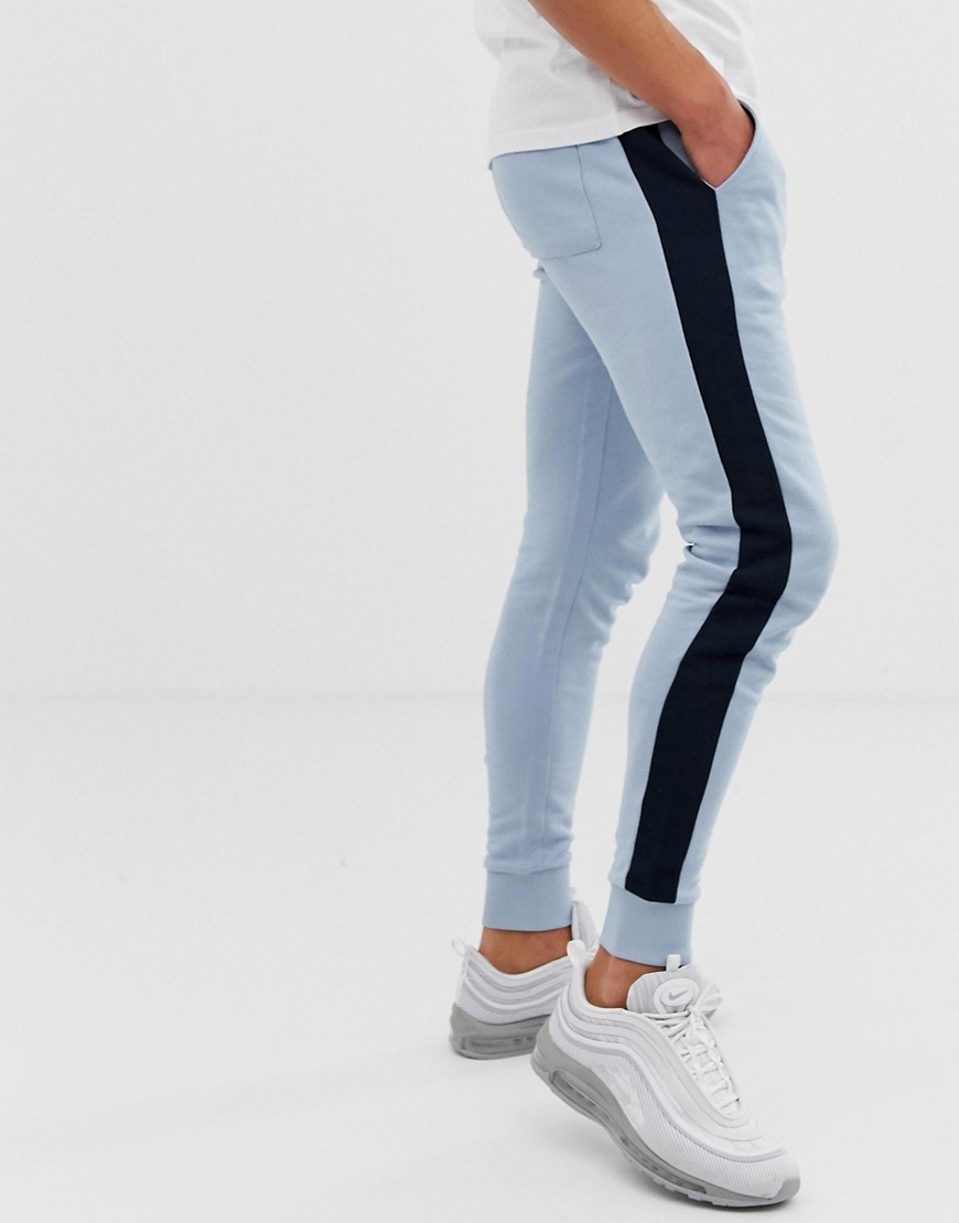 ASOS DESIGN skinny joggers with side stripe in light blue