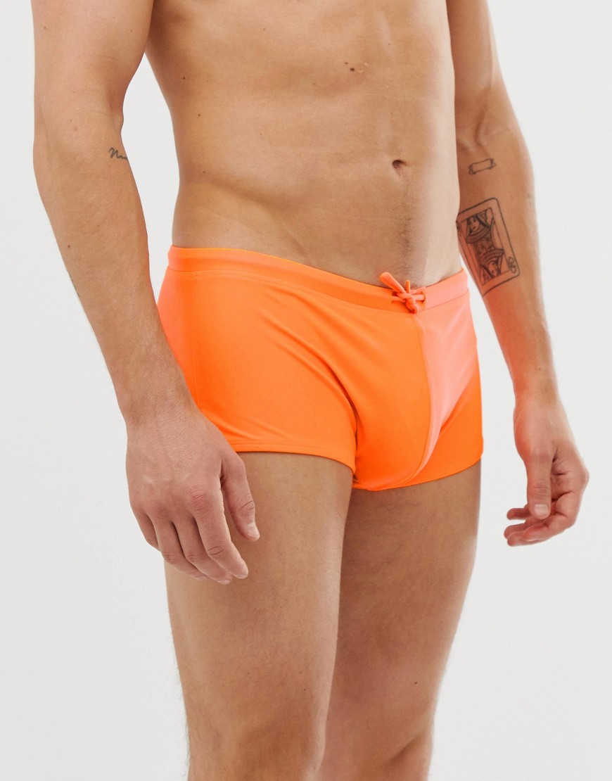 ASOS DESIGN swim trunks in neon orange