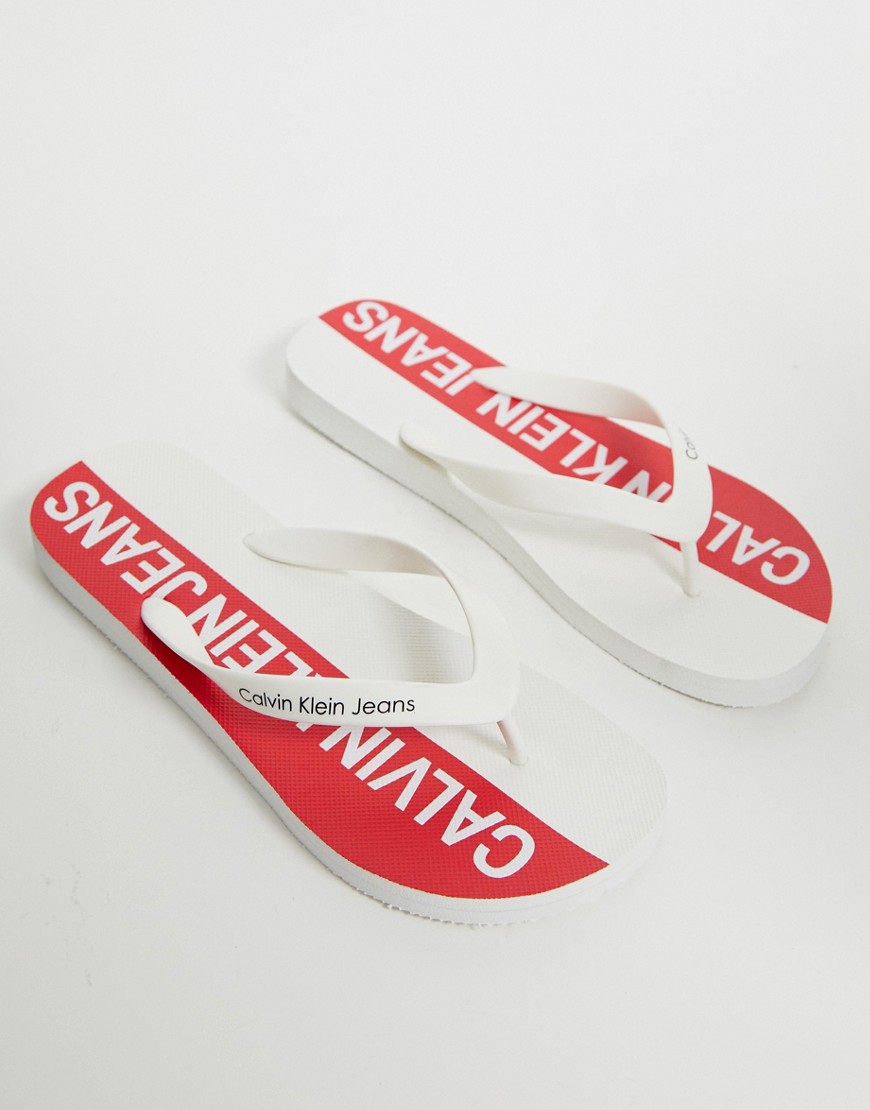 Calvin Klein Errol logo flip flops in white