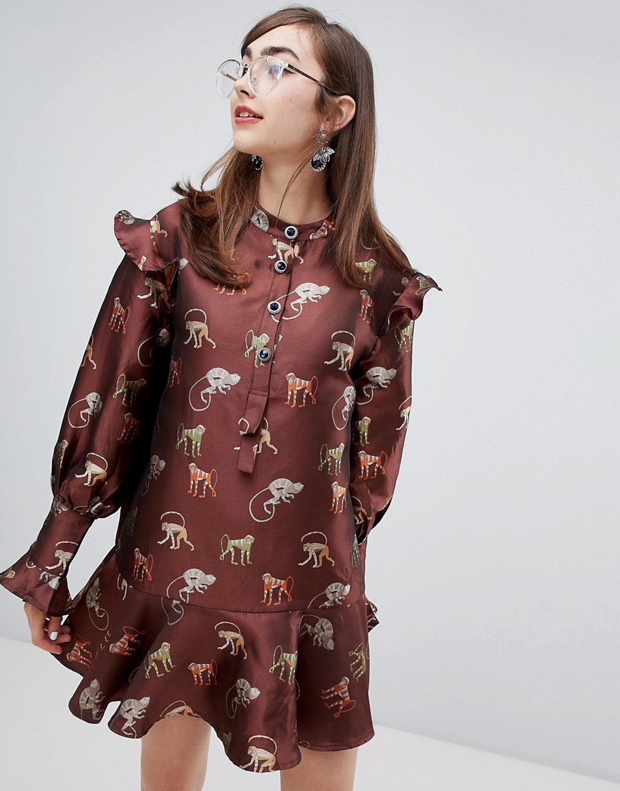 Sister Jane dress with peplum hem and jewel buttons in jungle jacquard embroidery