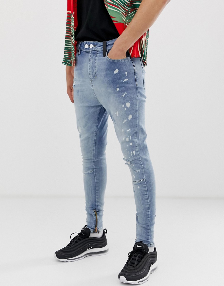 Religion drop crotch carrot fit jeans with zips in blue wash