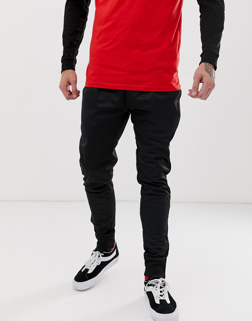 Mitchell & Ness track joggers in black