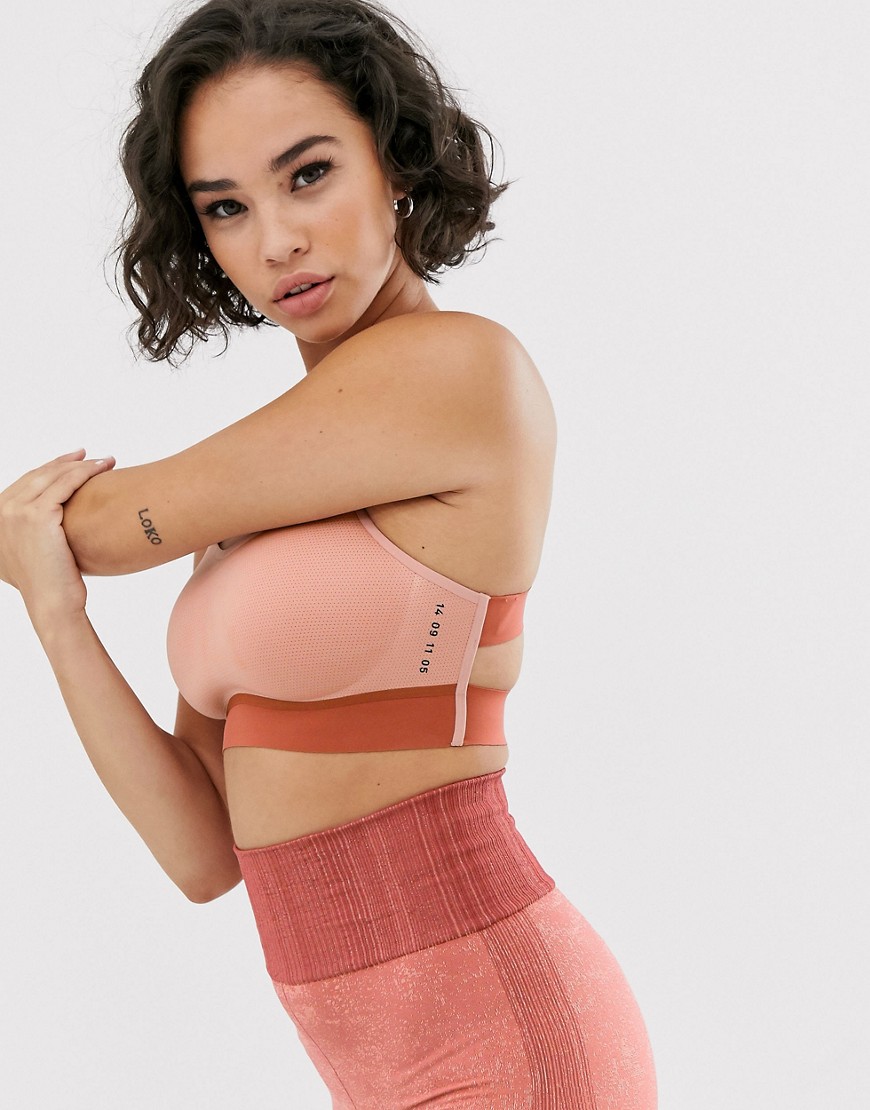 Nike Training mid support bra in rose gold