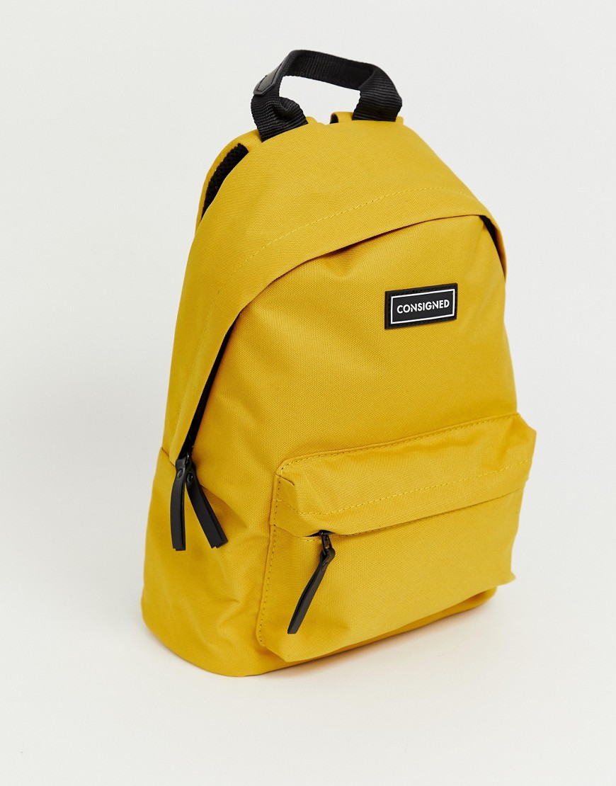 Consigned pocket front backpack