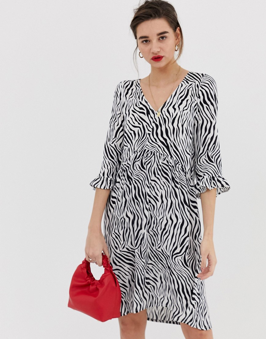 Soaked In Luxury zebra print dress with fluted sleeves