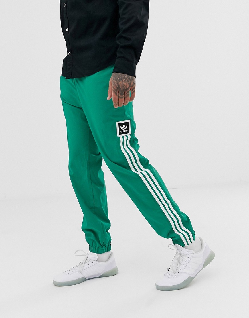 adidas Skateboarding joggers with 3 stripe in green