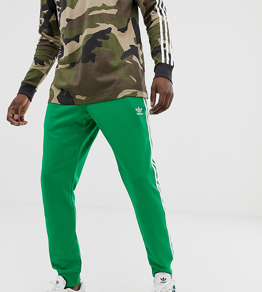 adidas Originals 3 -stripe skinny joggers with cuffed hem in green