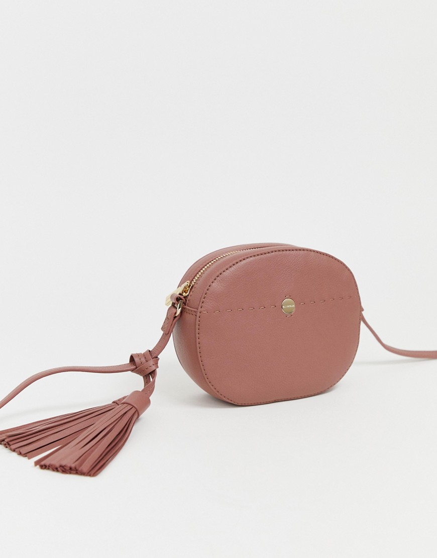Paul Costelloe real leather oval cross body bag with tassel