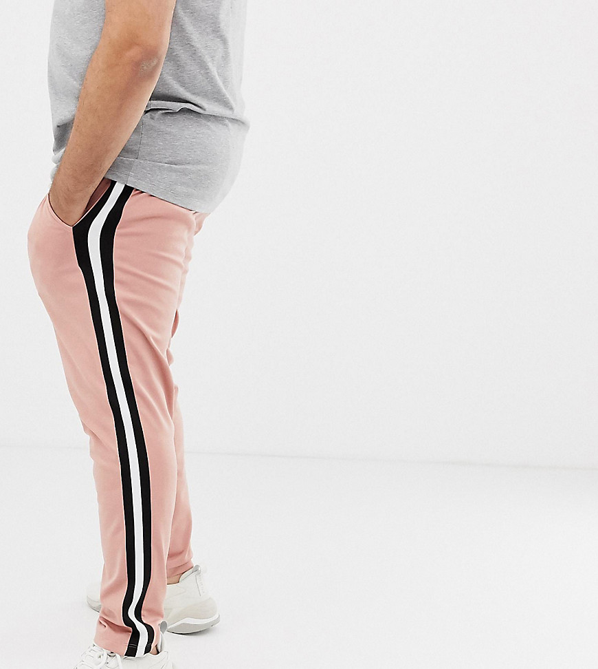 ASOS DESIGN Plus retro track skinny joggers with side stripe in pink