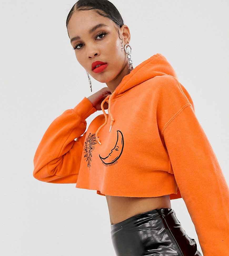 Reclaimed Vintage inspired cropped overdye hoodie in orange with sun and moon faces
