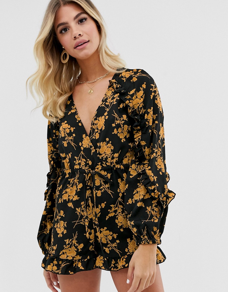 In The Style x Dani Dyer wrap front ruffle playsuit in black floral print