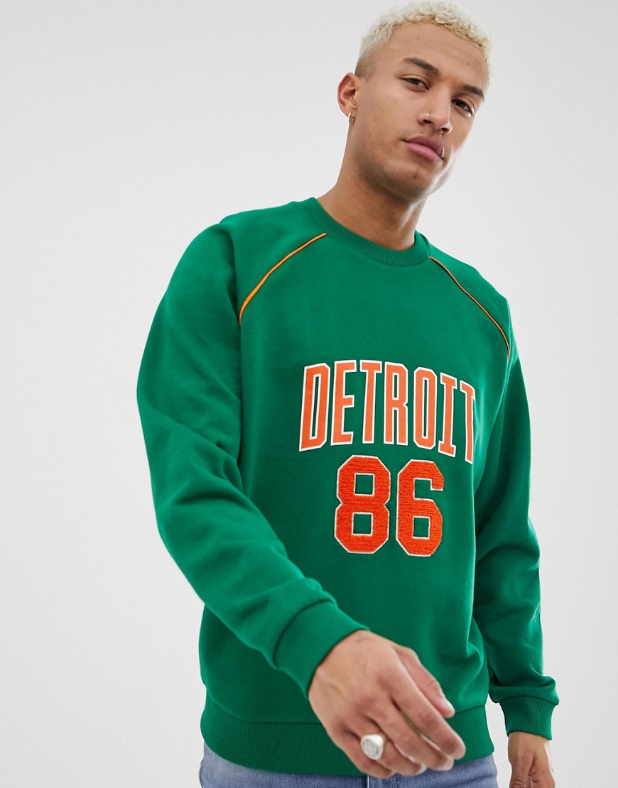 ASOS DESIGN - Grünes Sweatshirt mit City-Aufdruck - Grün