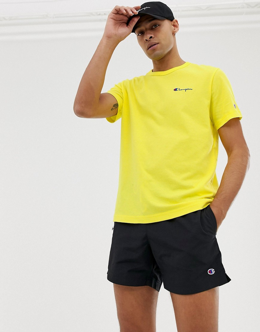Champion t-shirt with small script logo in yellow