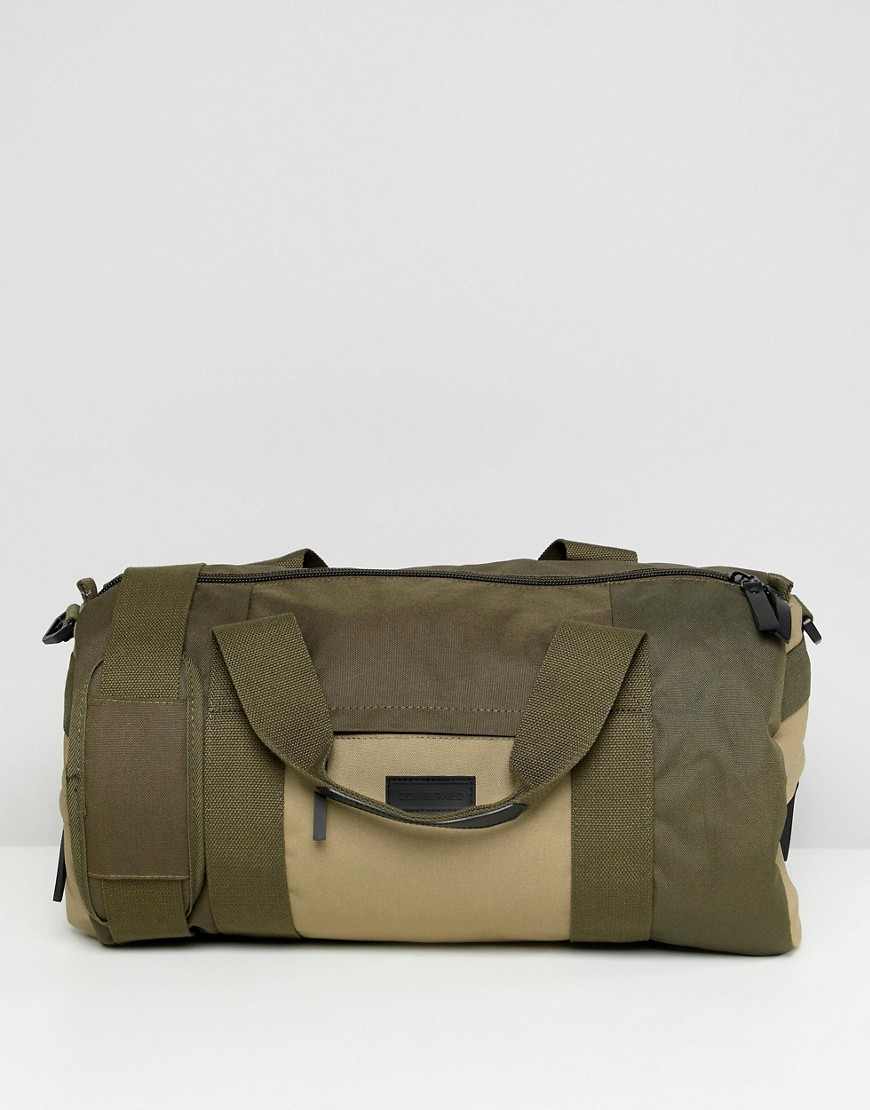 Consigned holdall with strap
