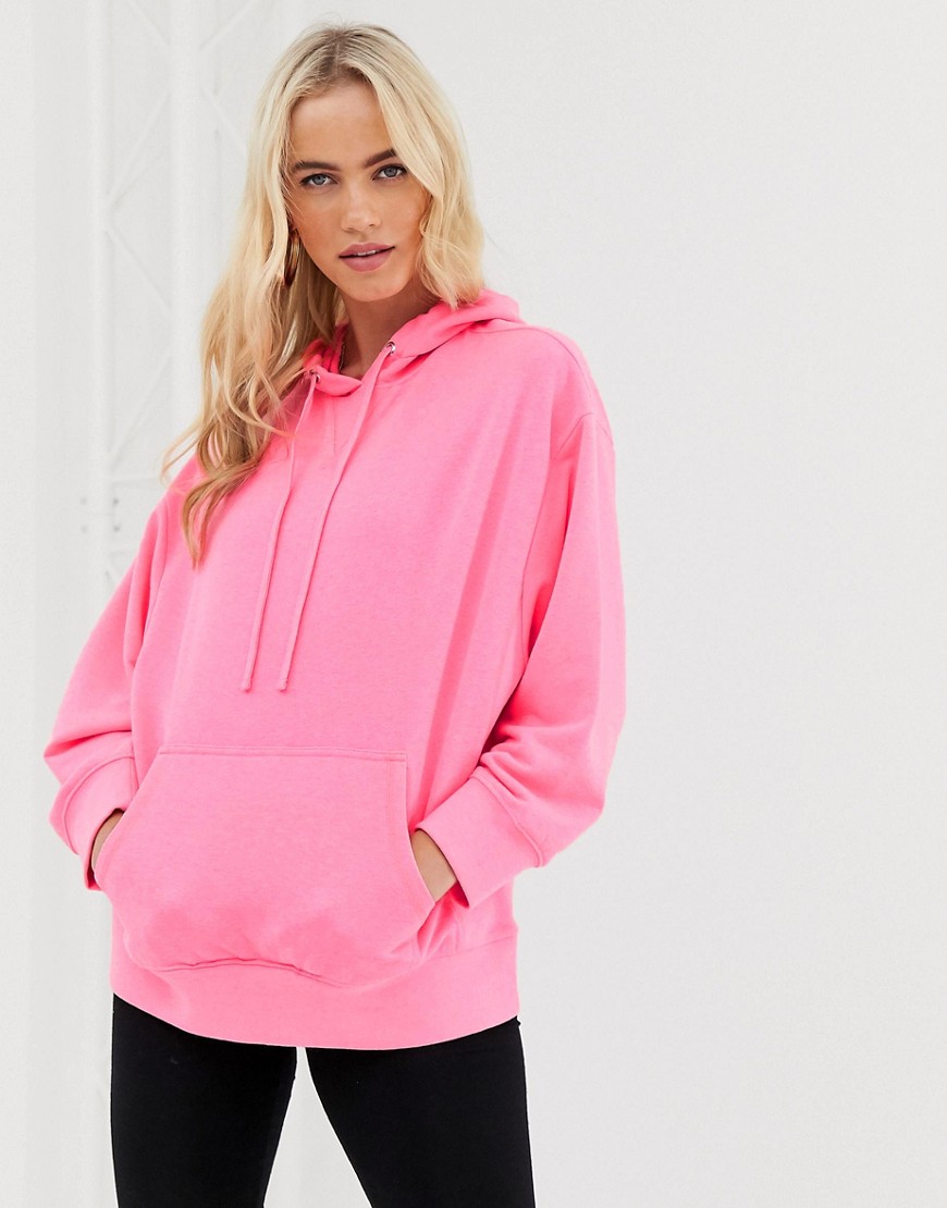 ASOS DESIGN oversized hoodie in washed neon pink