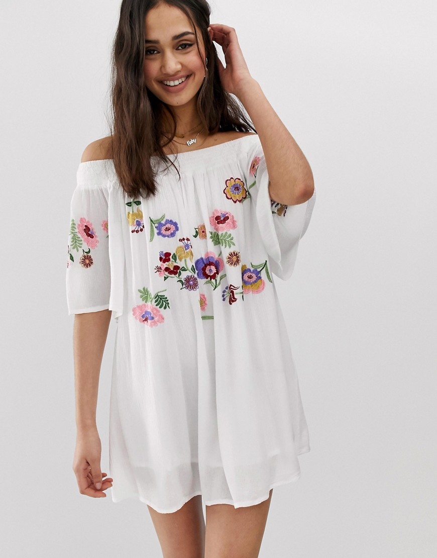 En Crème bardot mini dress with floral embroidery