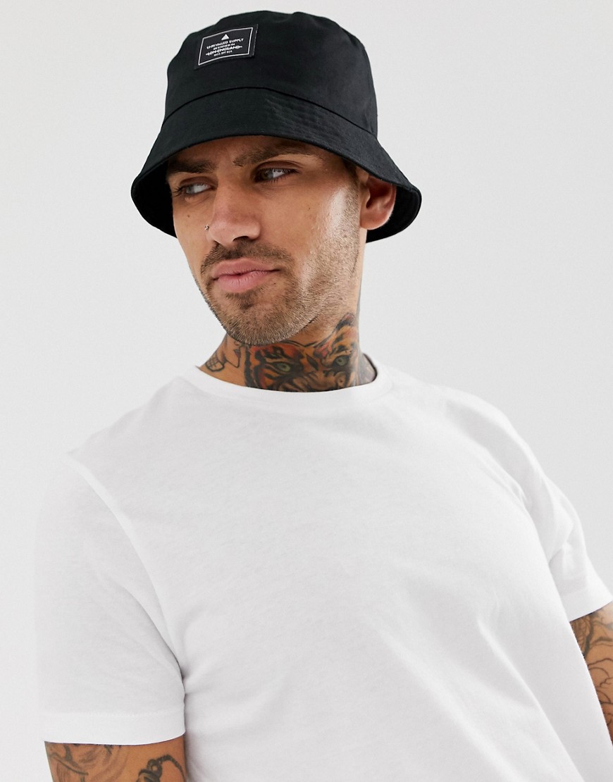 ASOS DESIGN bucket hat in black with branded patch