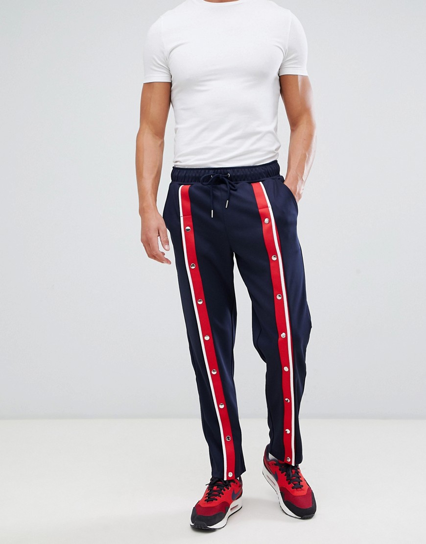 ASOS DESIGN retro track tapered joggers with front poppers and stripes