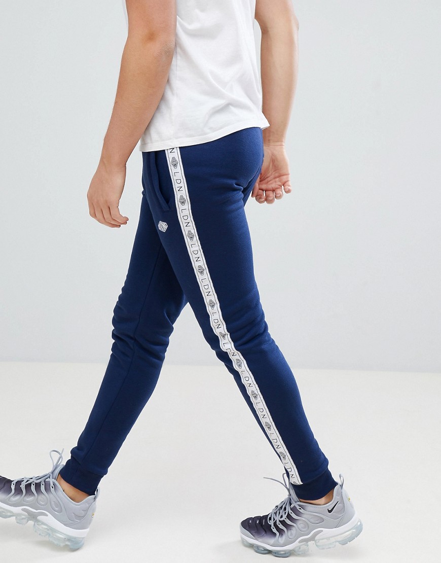 Divine Side Tape Tracksuit Joggers in Skinny Fit