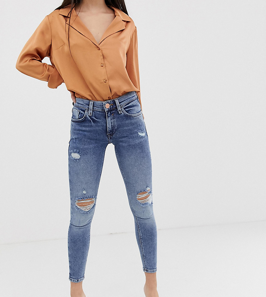 River Island Petite Amelie skinny jeans with distressed detail in mid wash