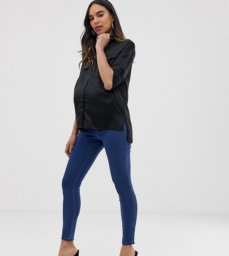 ASOS DESIGN Maternity pull on jeggings in mid wash blue with under the bump waistband