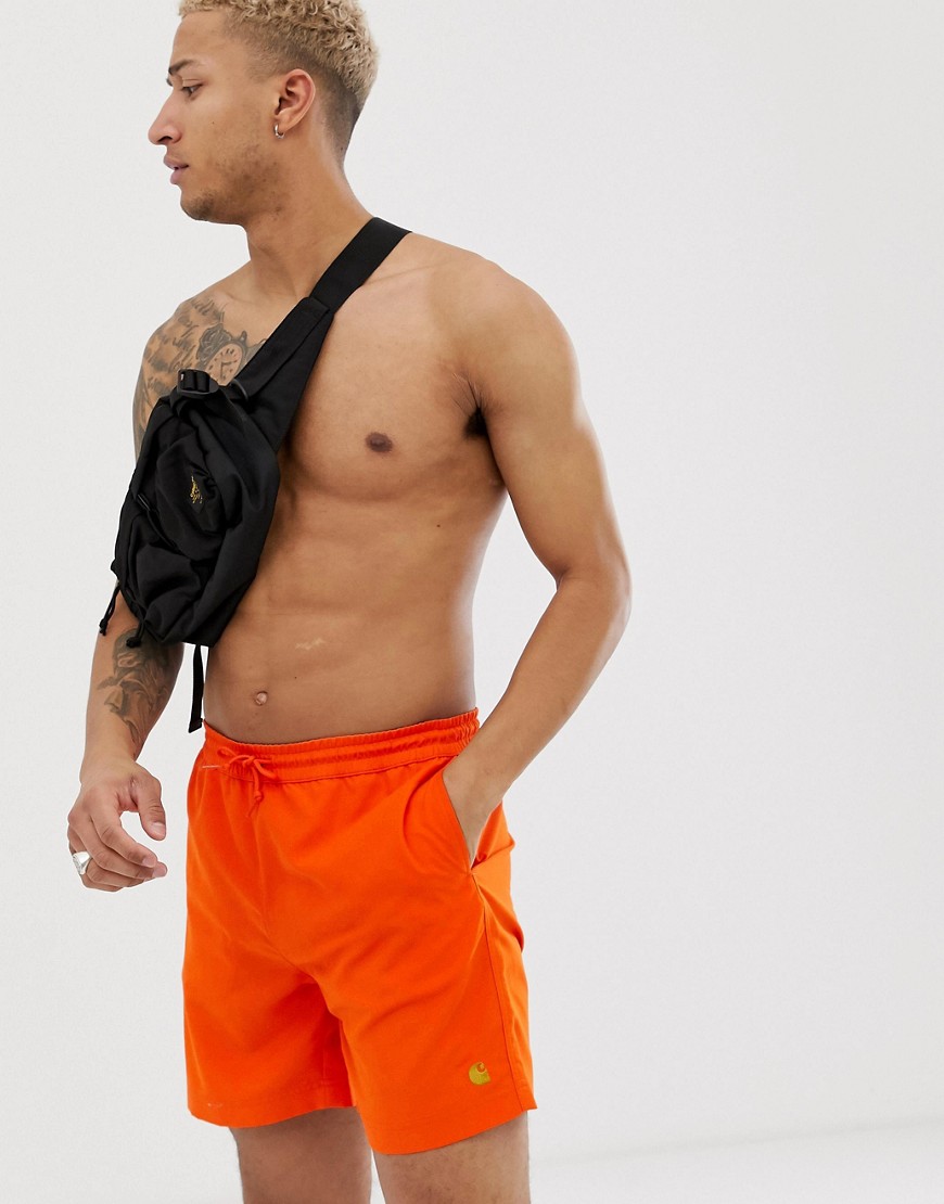 Carhartt WIP Chase swim shorts in orange
