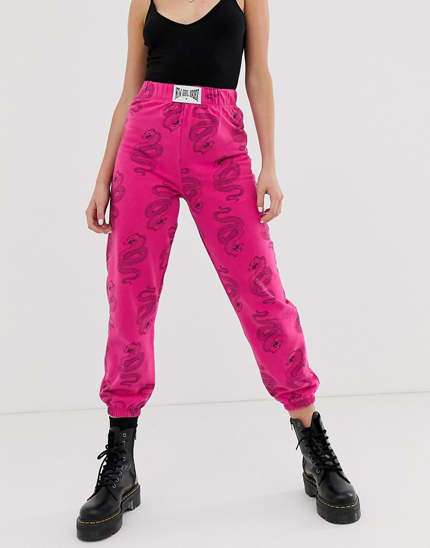 New Girl Order relaxed joggers with all over snake print and patch detail