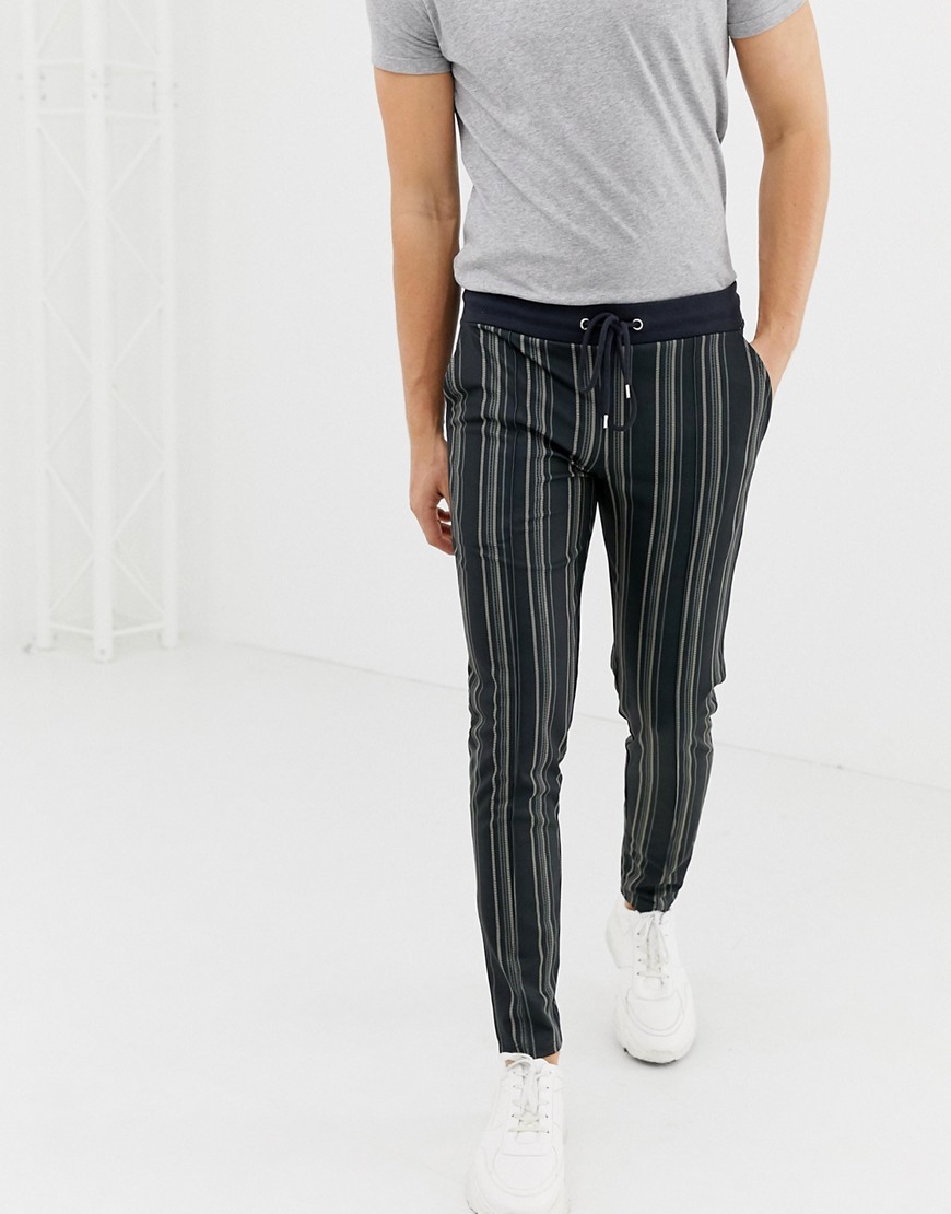ASOS DESIGN skinny joggers in poly tricot fabric with all over stripes