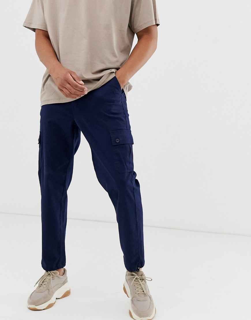 ASOS DESIGN tapered cargo trousers with toggles in navy