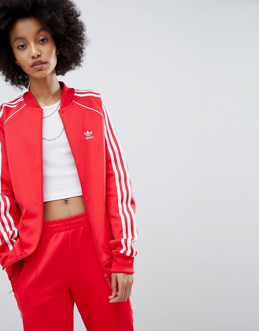 sabor dulce Anfibio papel Adidas Originals Adicolor Three Stripe Track Jacket In Red - Red | ModeSens