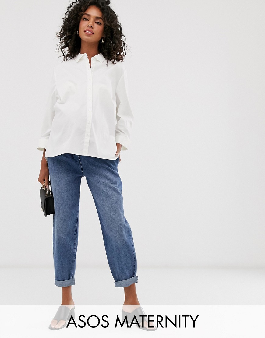 ASOS DESIGN Maternity tapered leg boyfriend jeans with curve seam in mid vintage wash with over the bump band