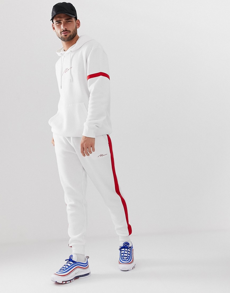 boohooMAN tracksuit with contrast stripe in white