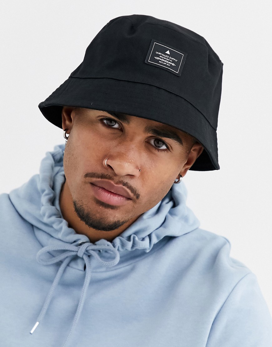 ASOS Unrvlld Supply bucket hat in black with branded patch