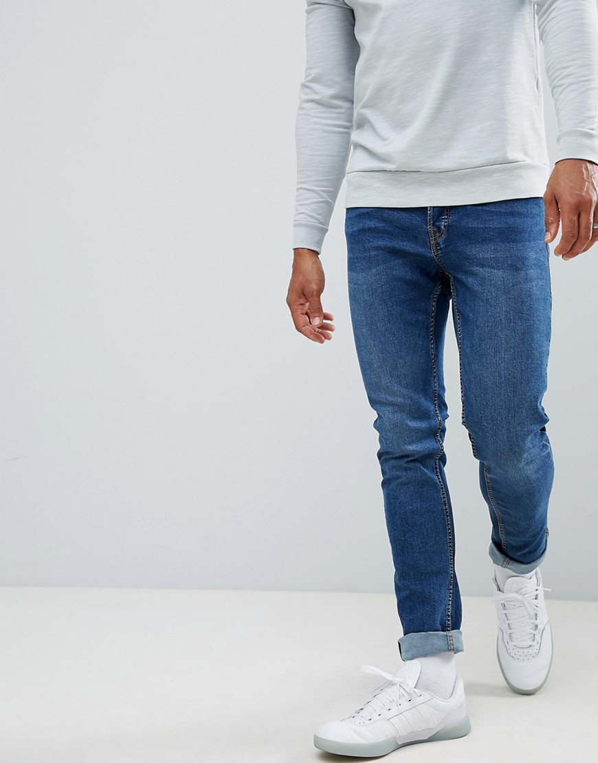 Jack & Jones Slim Taper Jeans In Mid Blue Denim