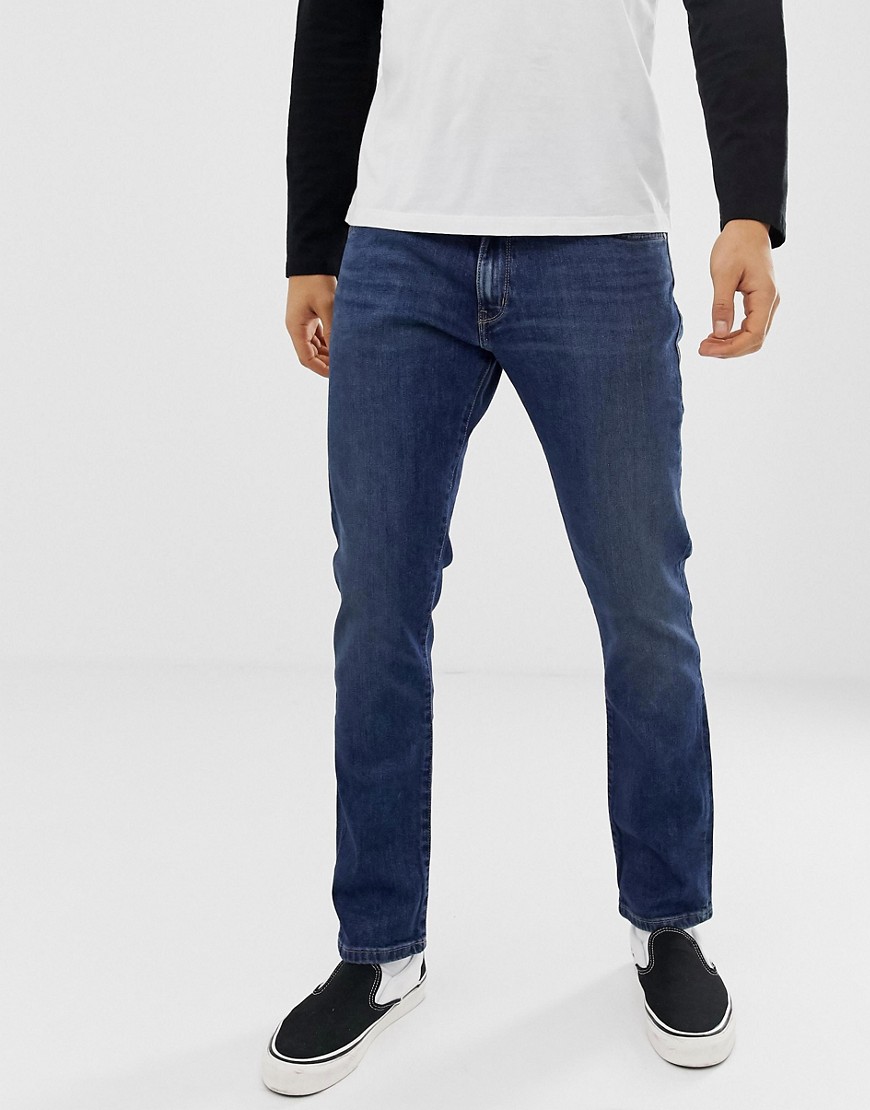 Wrangler larston slim tapered fit jeans in indigo mid wash
