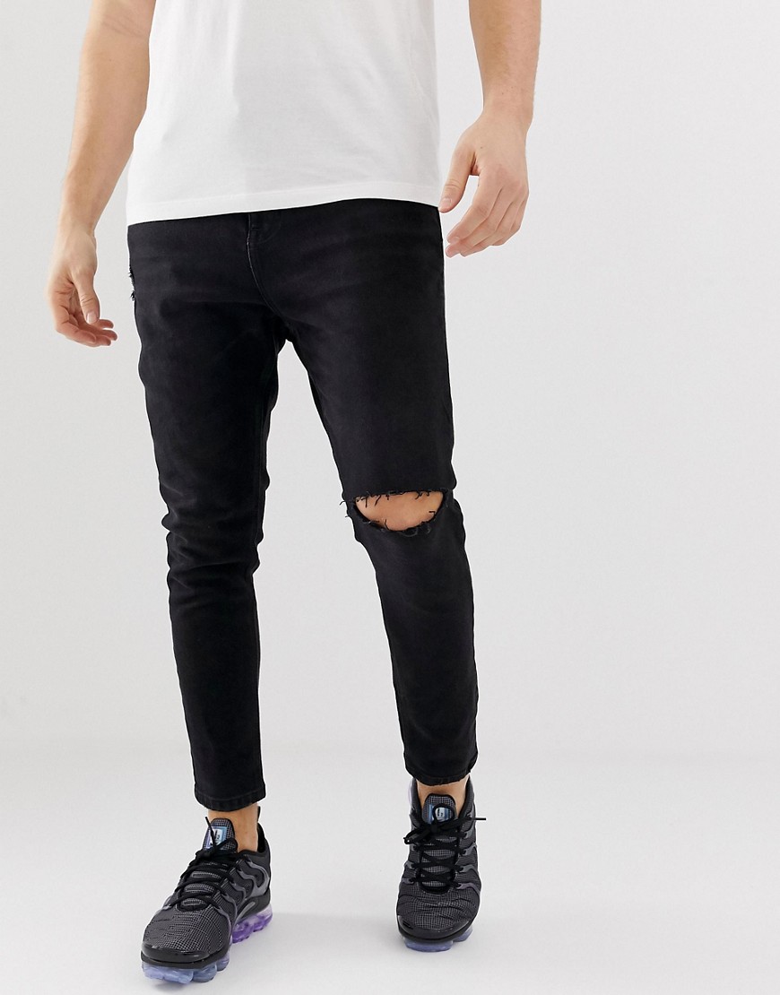 Bershka tapered carrot fit jeans with rips in black