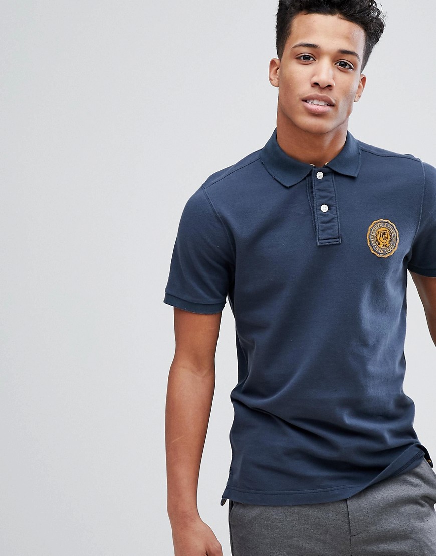 Abercrombie & Fitch Heritage Varsity Badge Logo Slim Fit Polo in Navy - Navy