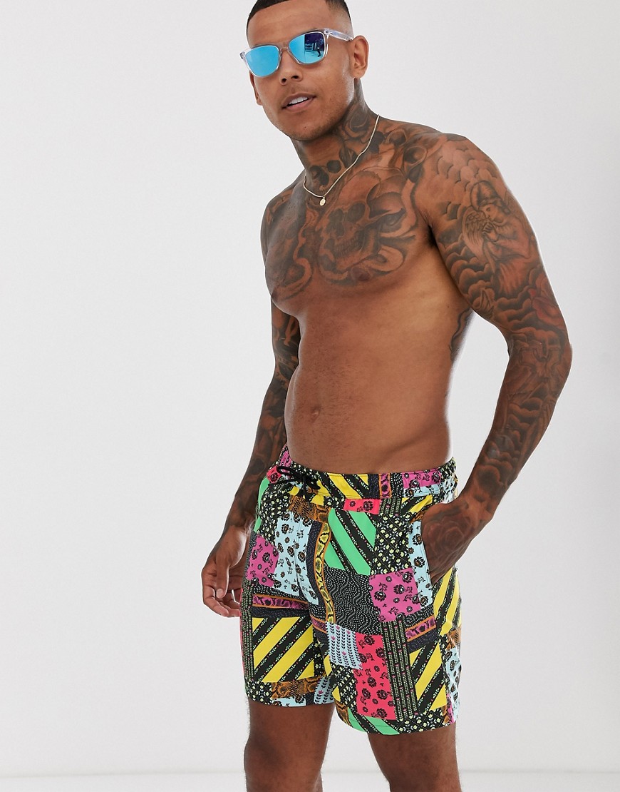 ASOS DESIGN swim shorts with retro patchwork print in mid length