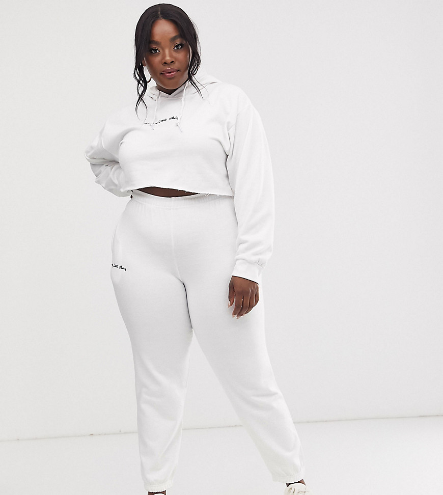 PrettyLittleThing Plus joggers with embroidered logo in white