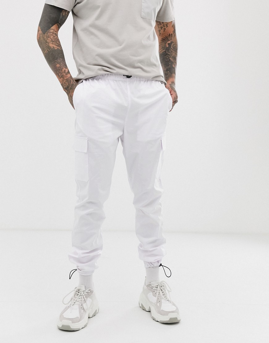 ASOS DESIGN tapered cargo trousers in white nylon
