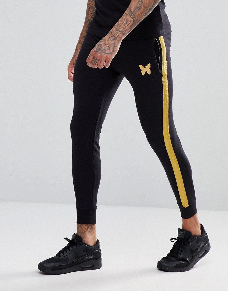 Good For Nothing skinny joggers in black with gold stripe