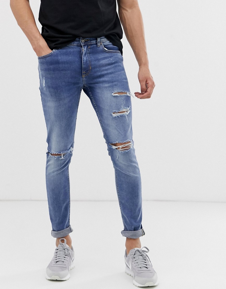 New Look skinny jeans with busted knee in light blue wash