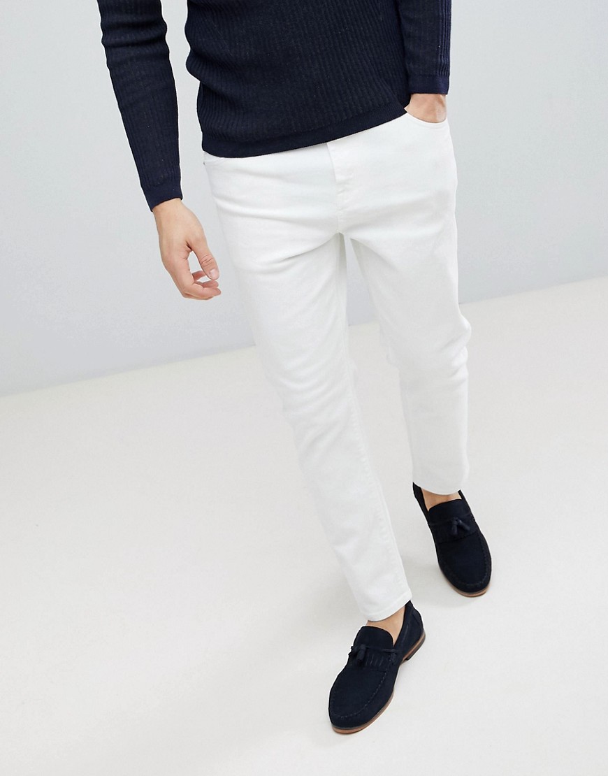 ASOS DESIGN Tapered jeans in white