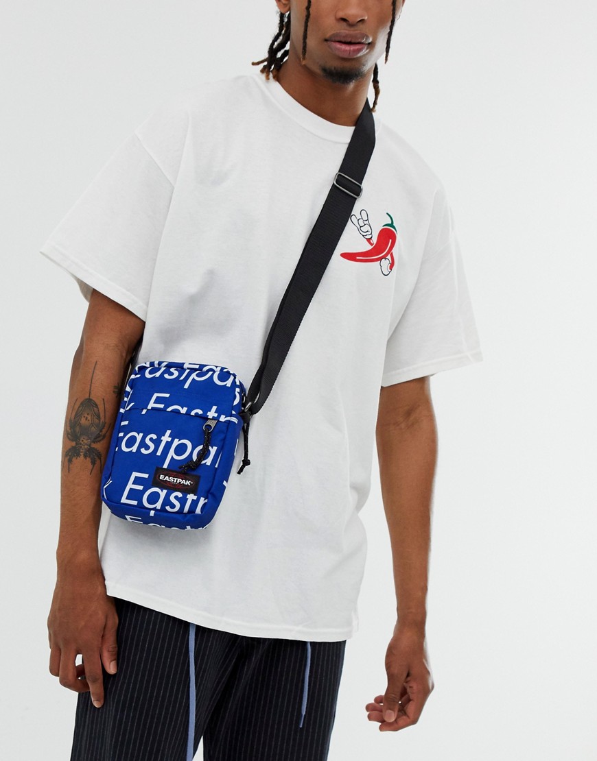 Eastpak The One 2.5l flight bag in all over logo print