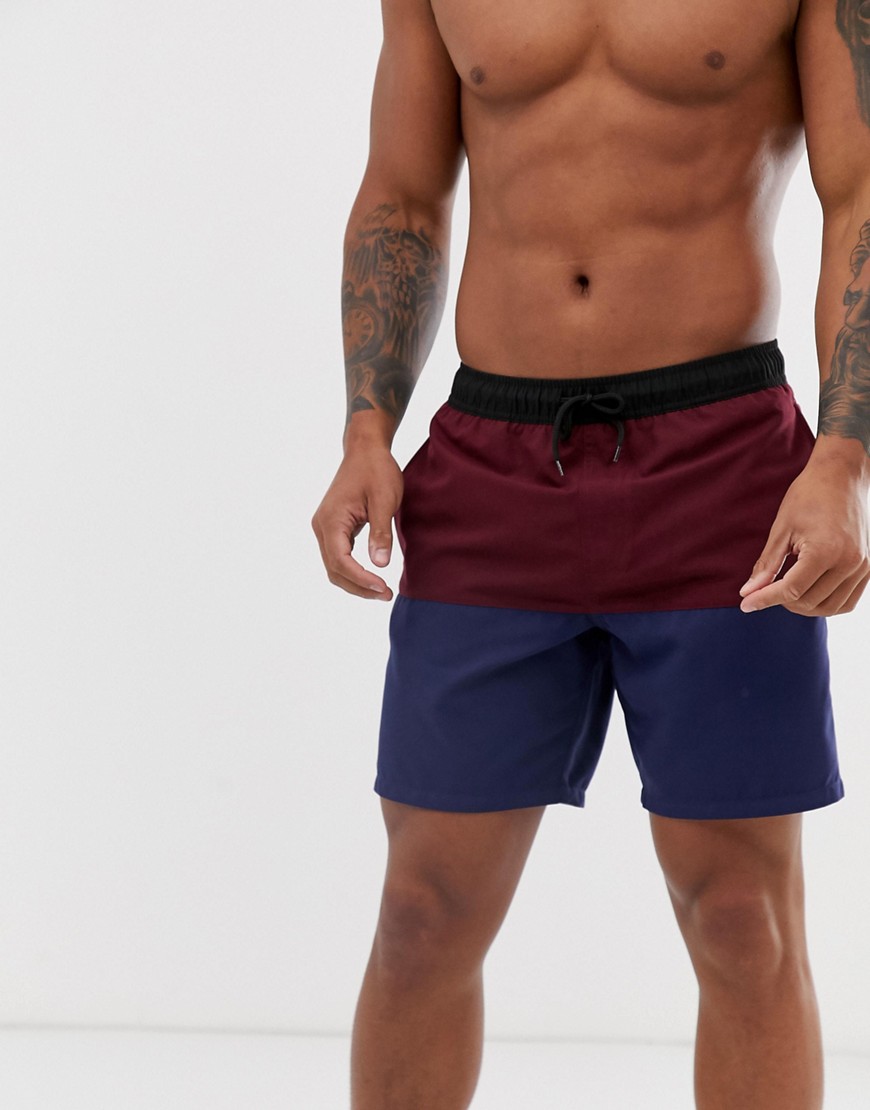 ASOS DESIGN swim shorts with burgundy and navy cut and sew in mid length